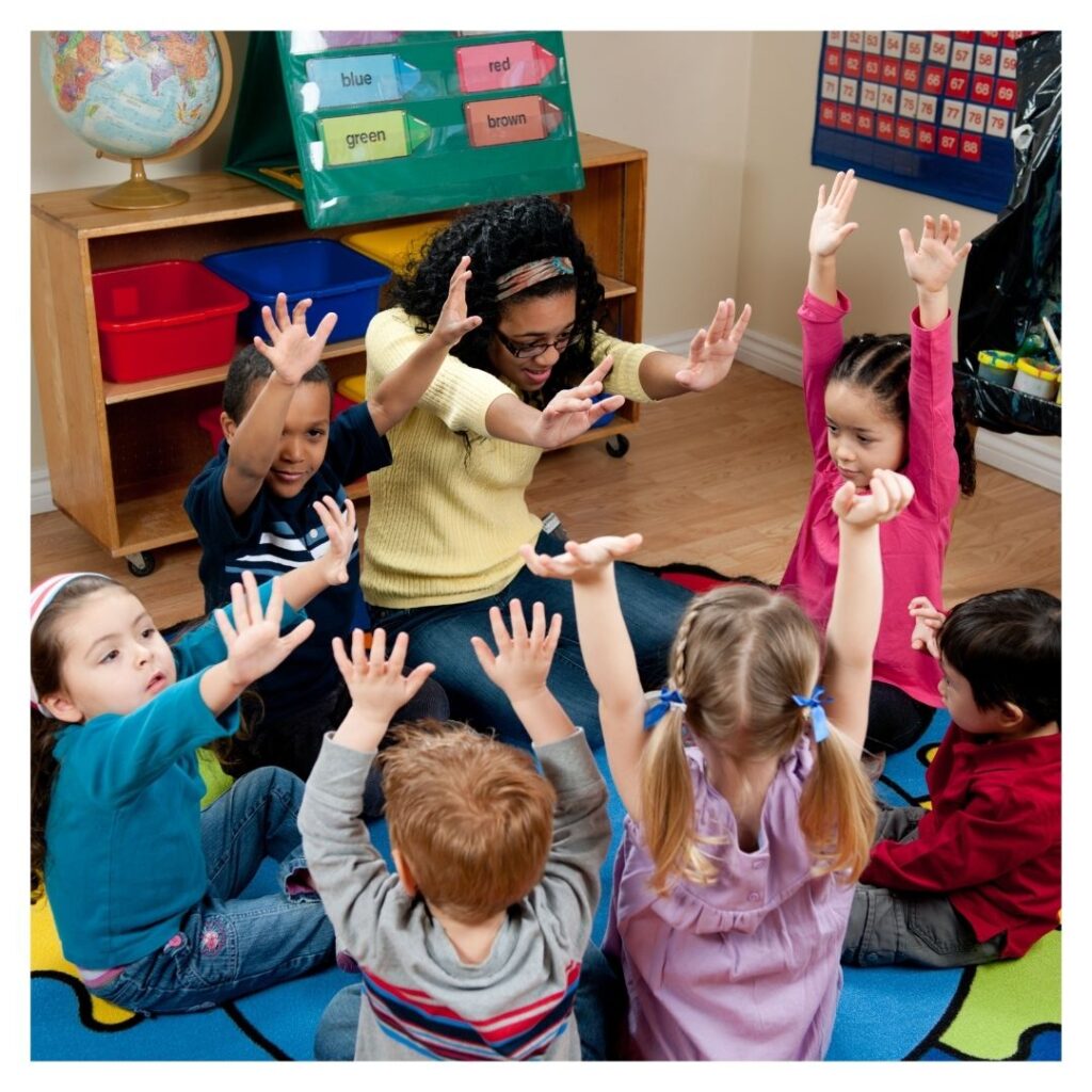 Teacher leading an interactive session with children.