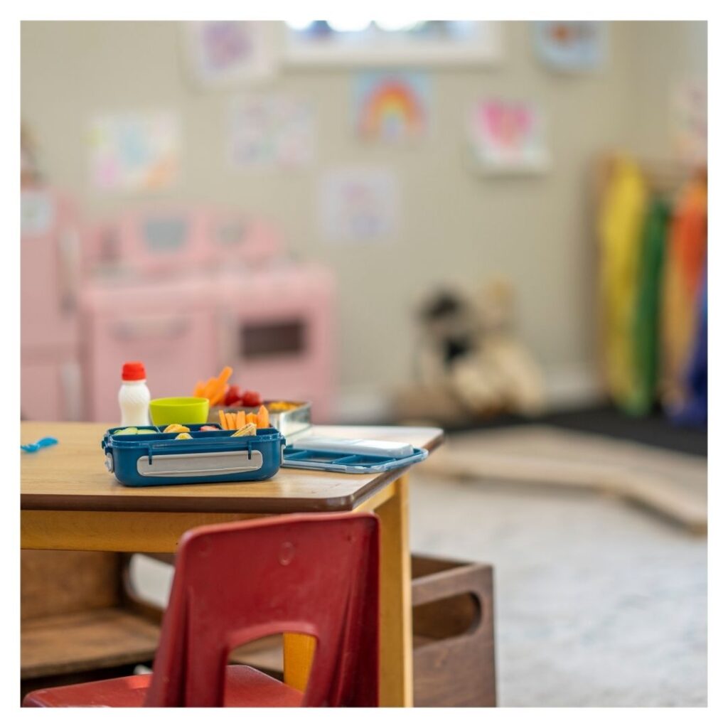 Preschool classroom with lunchbox on a table