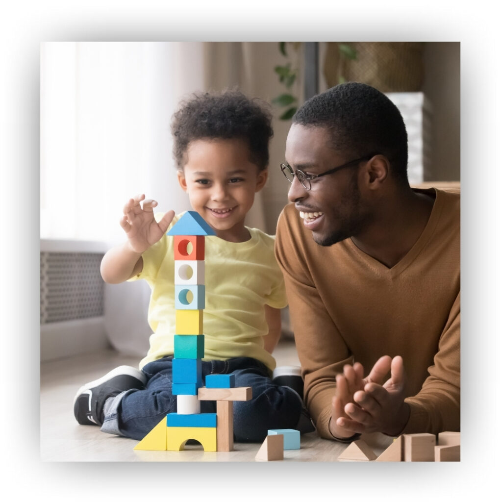 Parent and kid stacking blocks